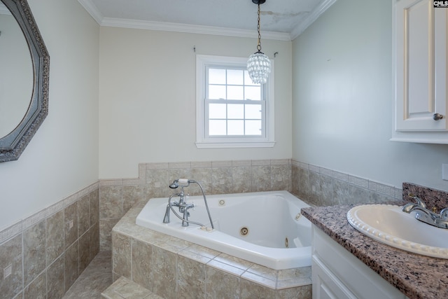 bathroom with vanity, ornamental molding, and tiled tub