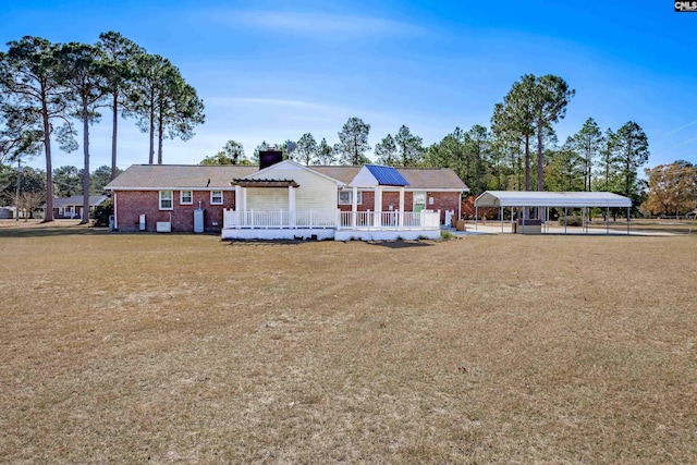 view of front of home with a carport and a wooden deck