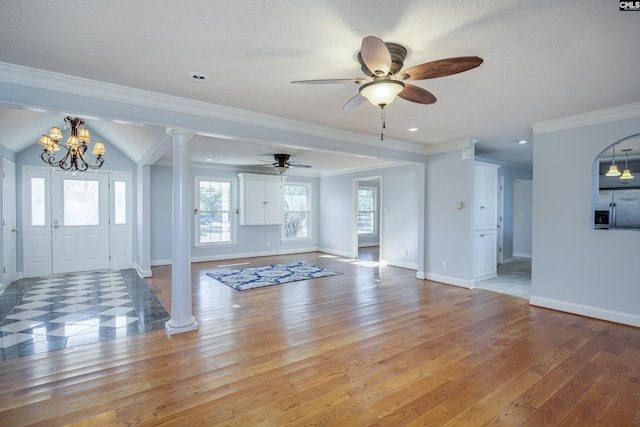 unfurnished living room featuring ceiling fan with notable chandelier, light wood-type flooring, and crown molding