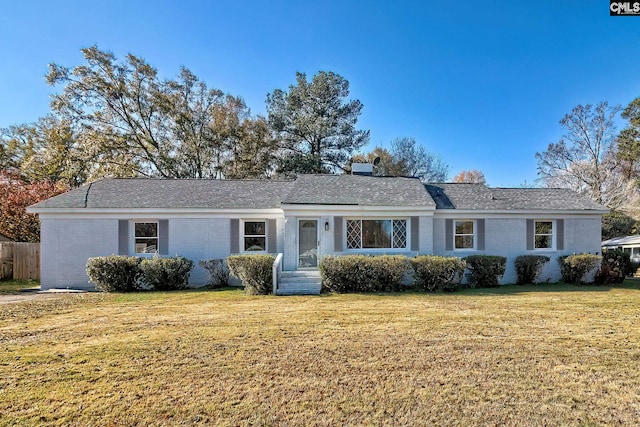 ranch-style house with a front lawn