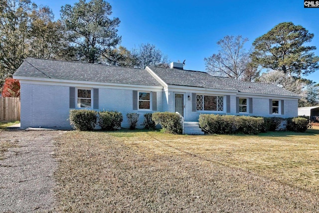 single story home featuring a front yard