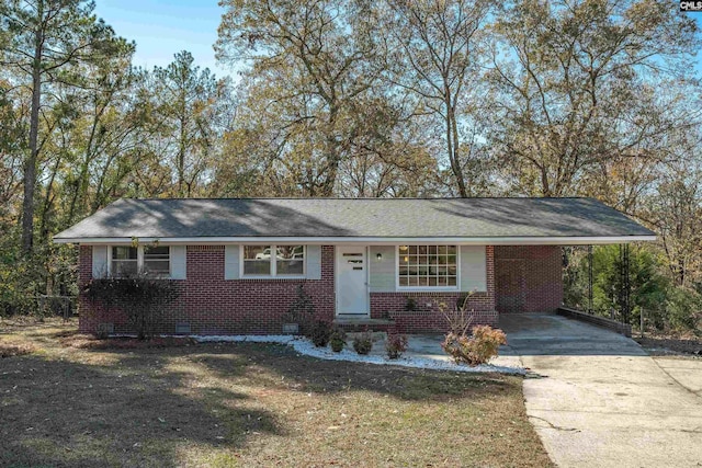 single story home with a carport and a front yard