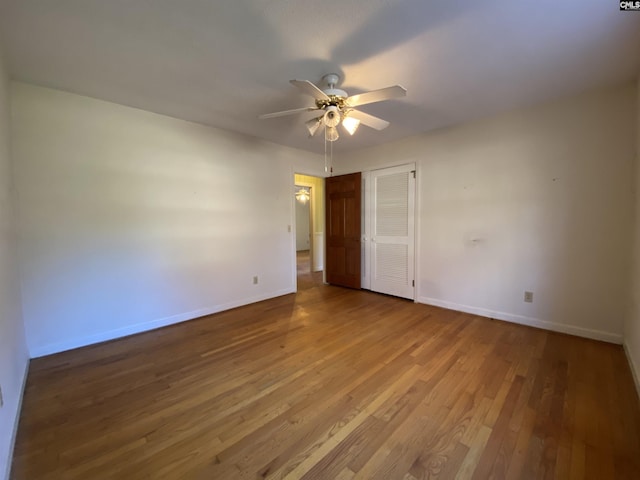 spare room featuring light hardwood / wood-style flooring and ceiling fan