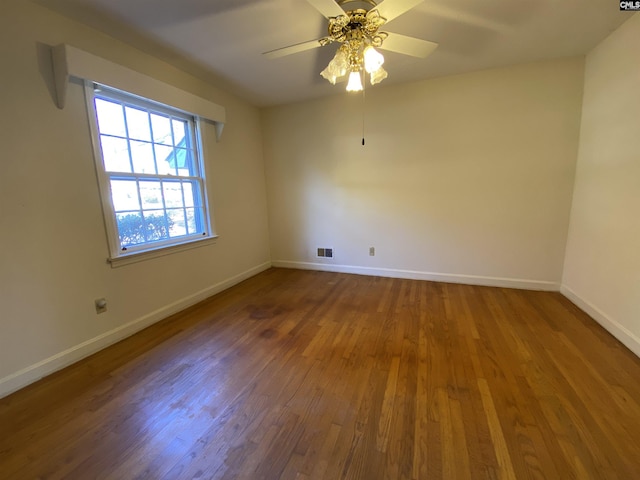 spare room featuring hardwood / wood-style flooring and ceiling fan