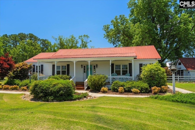 ranch-style house featuring a porch and a front lawn