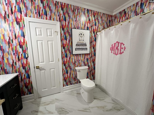 bathroom with vanity, toilet, and crown molding