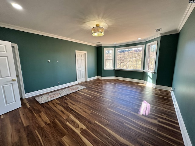 spare room with dark hardwood / wood-style floors and ornamental molding