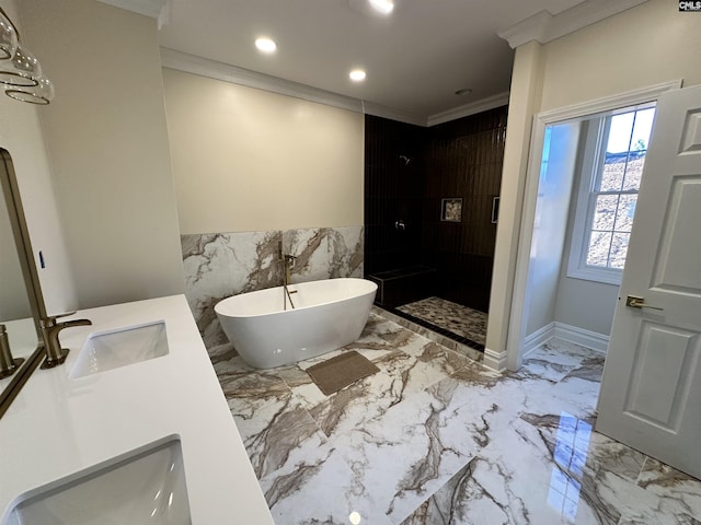 bathroom with vanity, ornamental molding, shower with separate bathtub, and tile walls