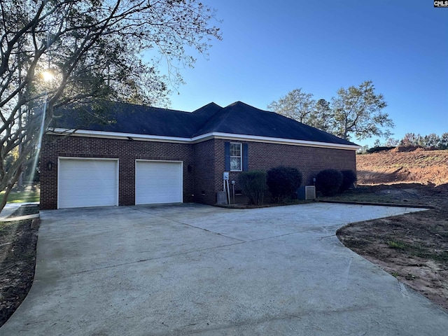 view of side of property with a garage