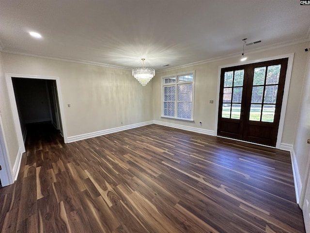 interior space featuring a chandelier, crown molding, french doors, and dark wood-type flooring