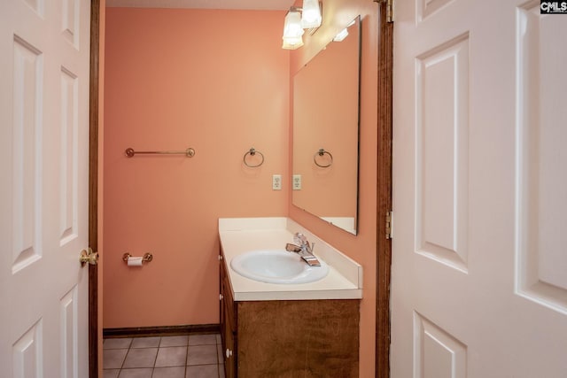 bathroom with tile patterned floors and vanity