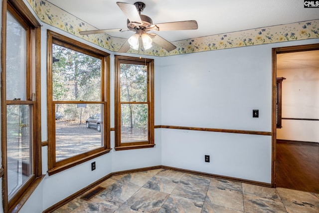 empty room featuring hardwood / wood-style flooring and ceiling fan