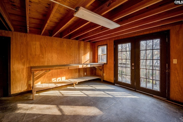 interior space with wooden walls and french doors