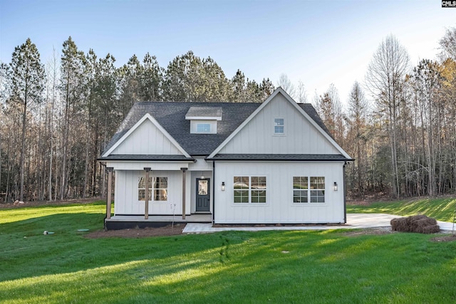 view of front of house with a front yard and a porch