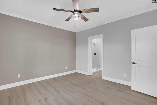 spare room featuring light hardwood / wood-style floors, ceiling fan, and crown molding