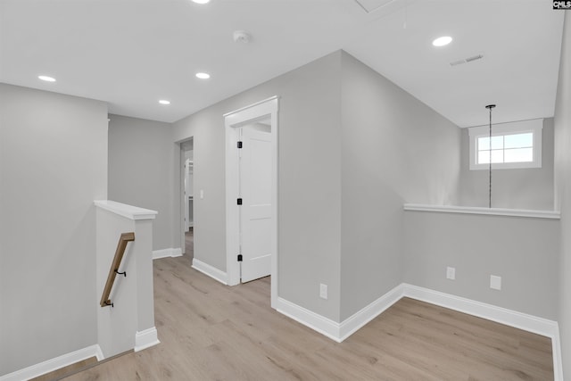 corridor featuring light hardwood / wood-style floors