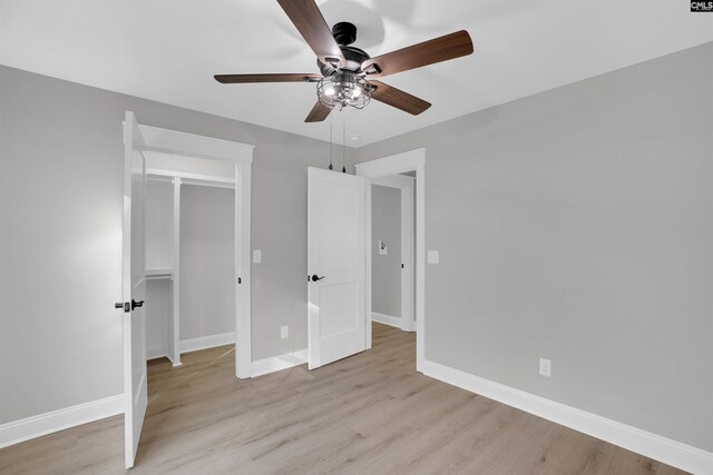 unfurnished bedroom featuring a closet, ceiling fan, and light hardwood / wood-style flooring