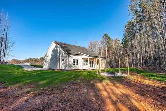 exterior space with a yard and covered porch