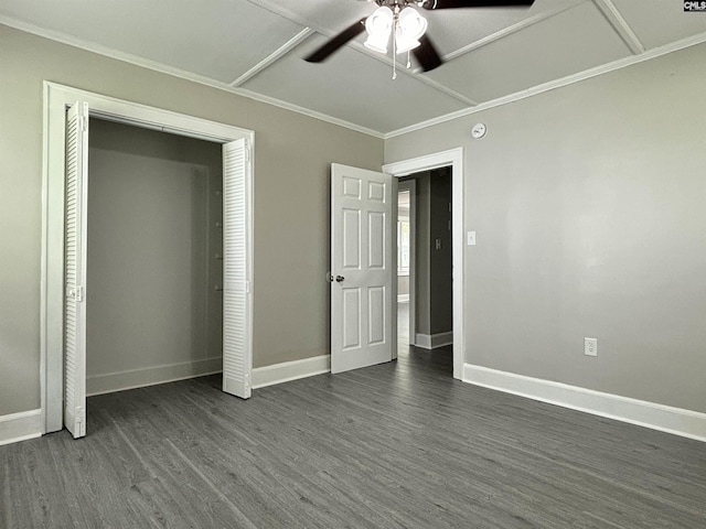 unfurnished bedroom featuring a closet, ceiling fan, dark hardwood / wood-style flooring, and ornamental molding