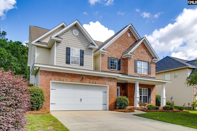 traditional-style home featuring an attached garage, covered porch, concrete driveway, and brick siding