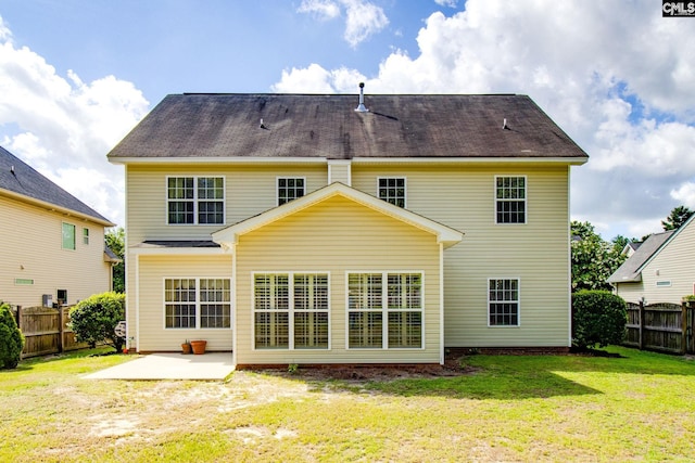 back of house featuring a patio area, a fenced backyard, and a yard