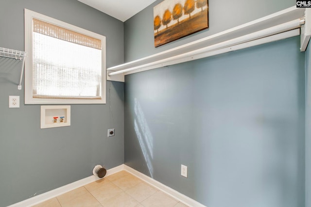 laundry area featuring light tile patterned floors, hookup for a washing machine, hookup for an electric dryer, laundry area, and baseboards