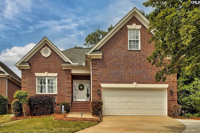 front facade with a garage and a front yard