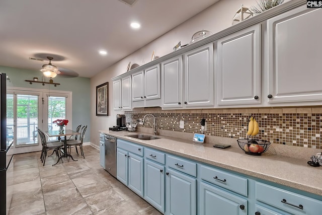 kitchen featuring blue cabinetry, ceiling fan, sink, and stainless steel dishwasher