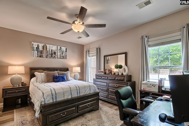 bedroom featuring ceiling fan and light hardwood / wood-style floors