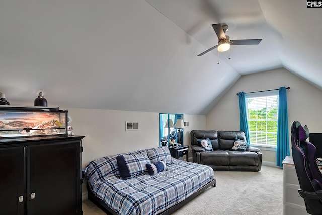 carpeted bedroom featuring vaulted ceiling and ceiling fan