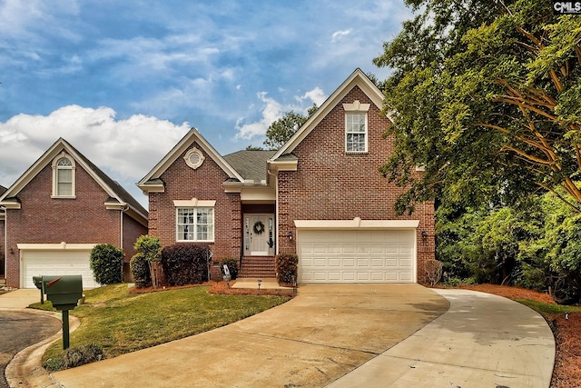 view of front of property featuring a garage and a front yard