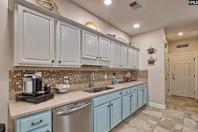 kitchen featuring white cabinetry, sink, stainless steel dishwasher, and blue cabinets