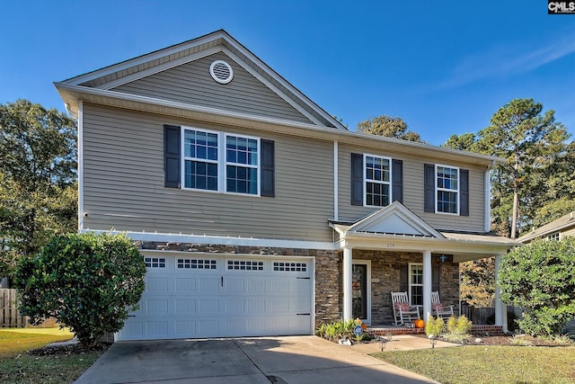 view of front facade with a porch and a garage