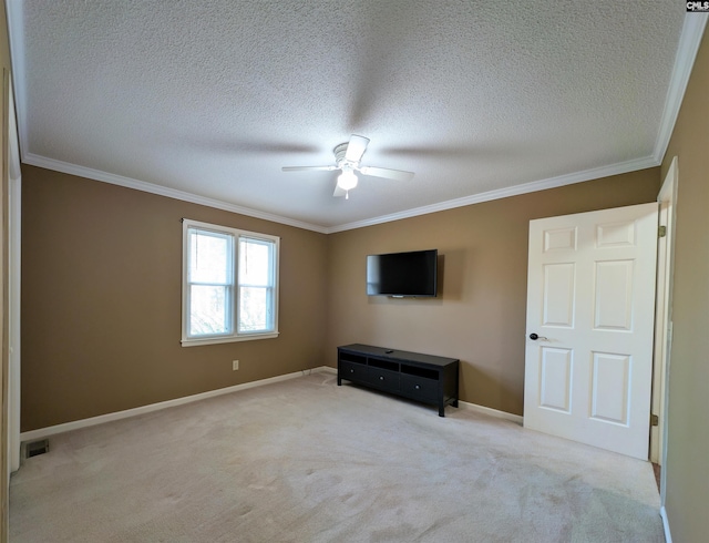 unfurnished bedroom with a textured ceiling, light colored carpet, and ceiling fan