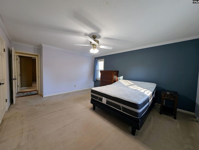 bedroom featuring ceiling fan, light colored carpet, ornamental molding, and a textured ceiling