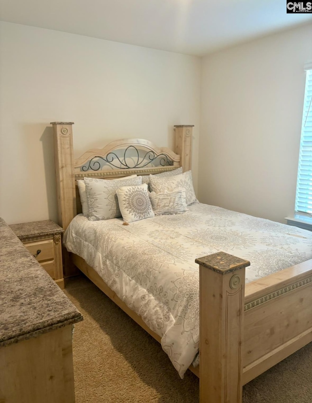 bedroom featuring dark colored carpet