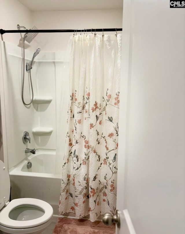 bathroom featuring toilet and shower / bath combo with shower curtain