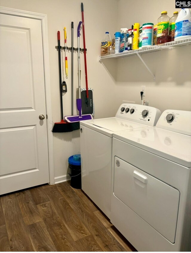 laundry room featuring dark hardwood / wood-style flooring and washing machine and clothes dryer