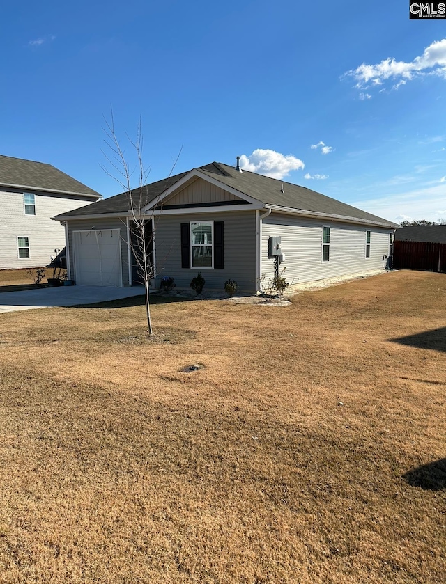 single story home with a garage and a front yard