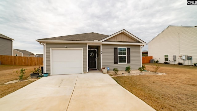 view of front of house featuring cooling unit and a garage