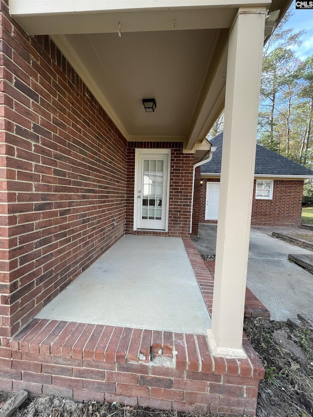 doorway to property with a patio area