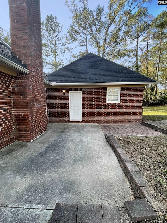 view of property exterior featuring a patio area