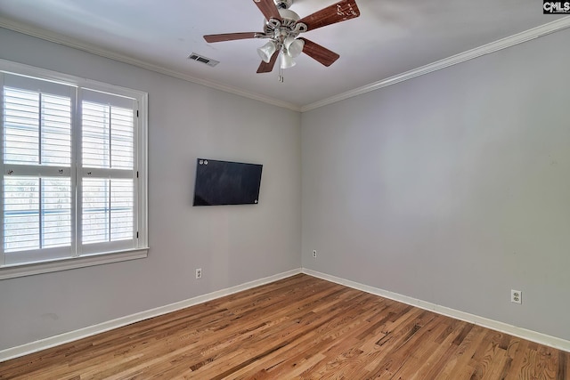 spare room featuring light hardwood / wood-style floors, ceiling fan, and ornamental molding