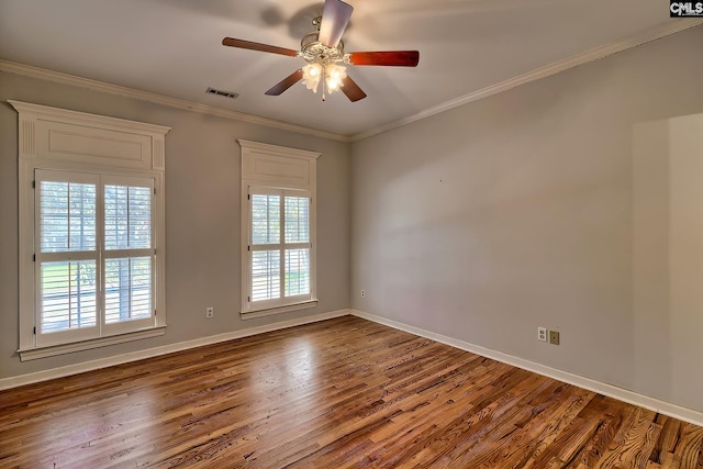 unfurnished room featuring crown molding, ceiling fan, a healthy amount of sunlight, and hardwood / wood-style flooring