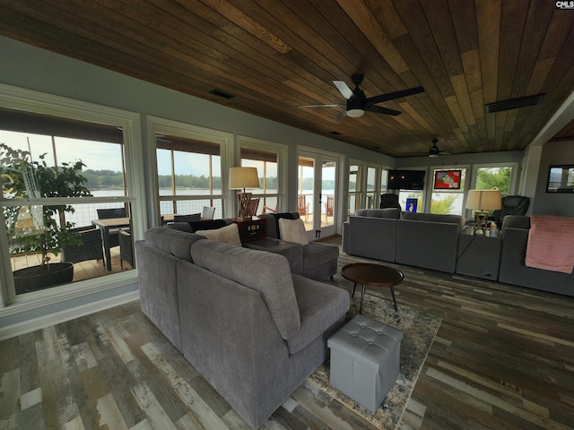 living room featuring dark hardwood / wood-style floors, ceiling fan, wooden ceiling, and french doors