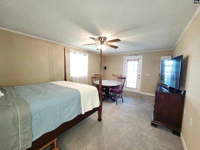 carpeted bedroom featuring access to exterior, ceiling fan, crown molding, and a textured ceiling