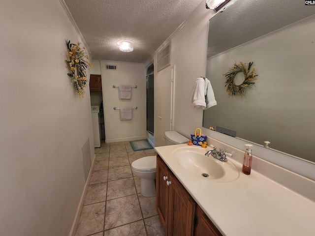 bathroom with crown molding, a textured ceiling, washer / dryer, a shower with door, and vanity