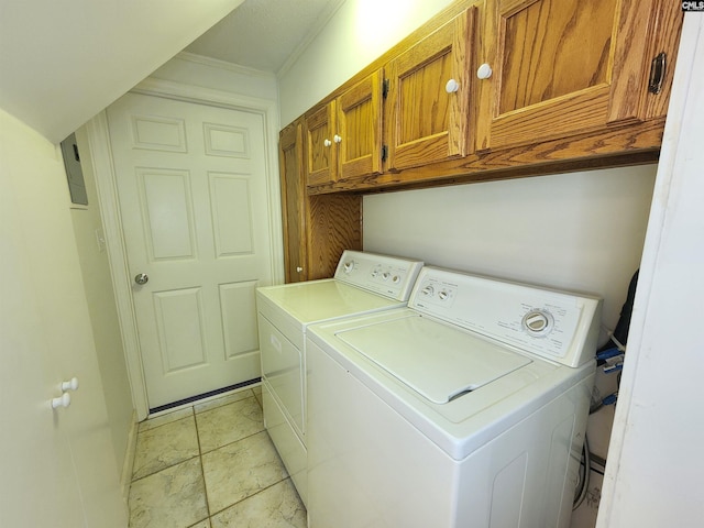 clothes washing area with separate washer and dryer, crown molding, and cabinets