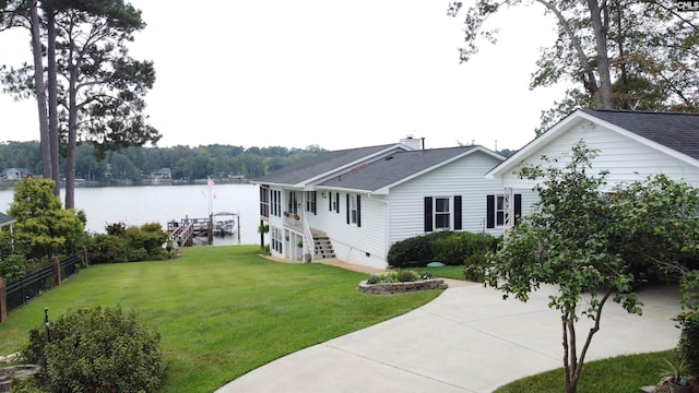 exterior space with a front yard and a water view