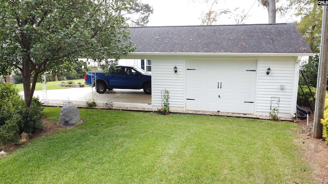 garage featuring a yard